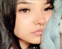 She has piercing in her nose septum and also about four piercing in her ears She has piercing in her nose septum and also about four piercing in her ears.